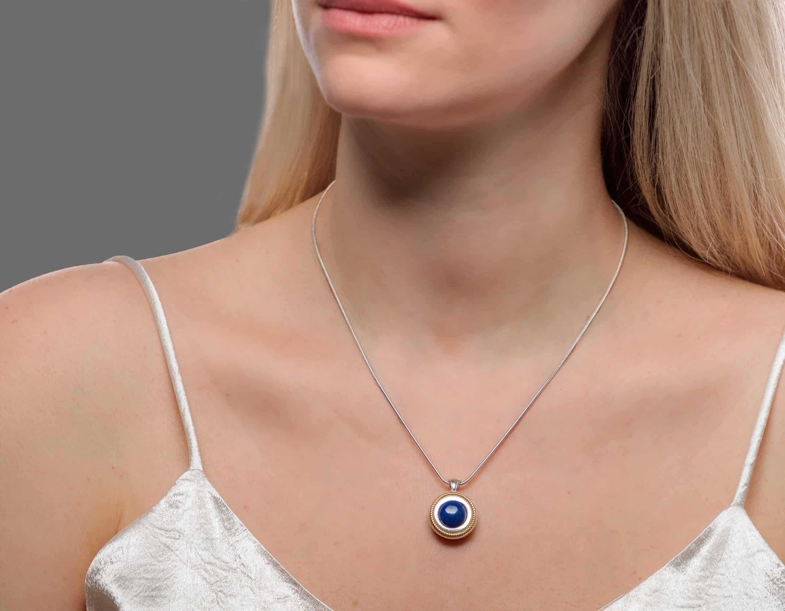 Fire Rope Sphere necklace worn on model